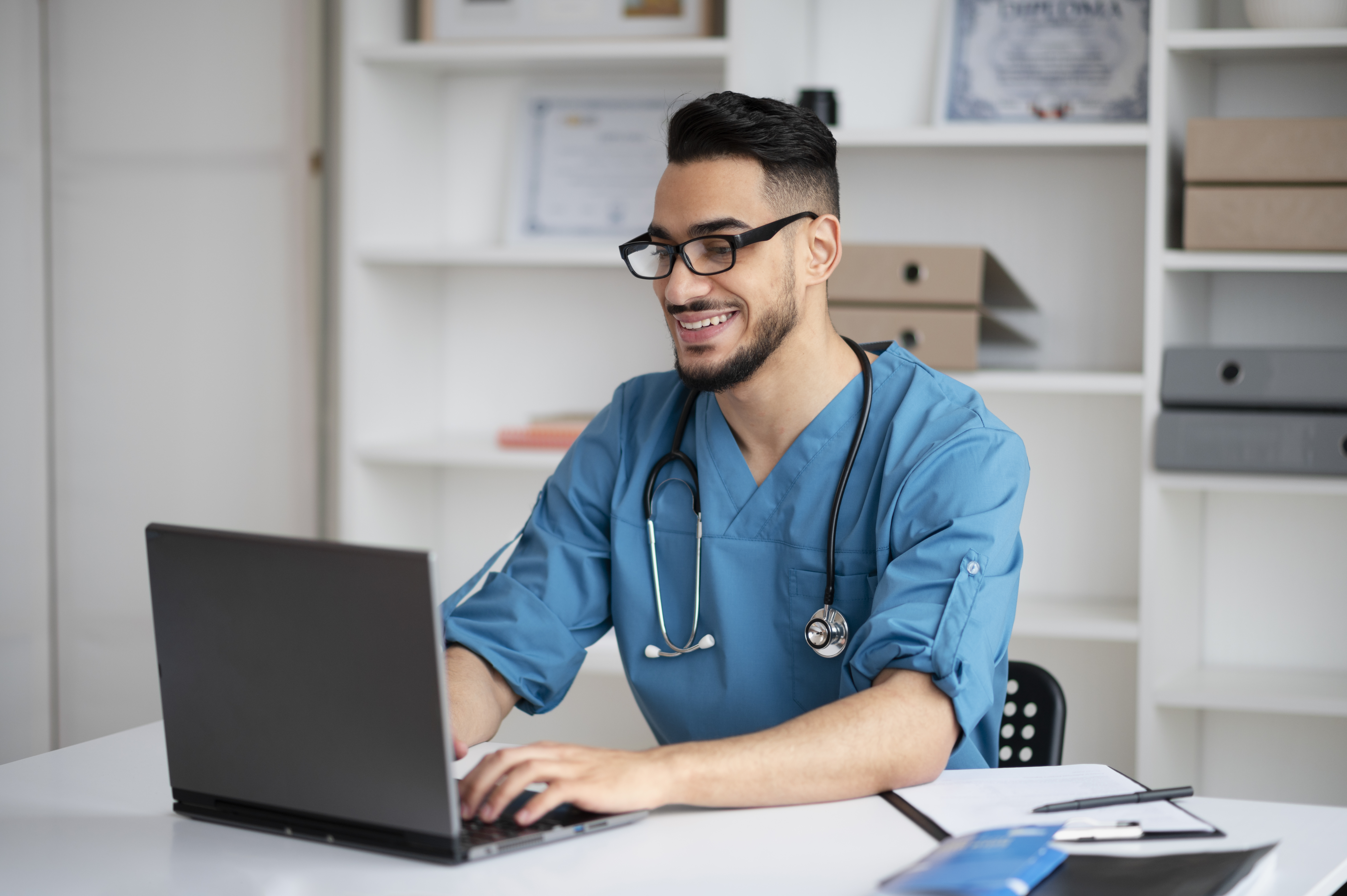 Male nurse using computer